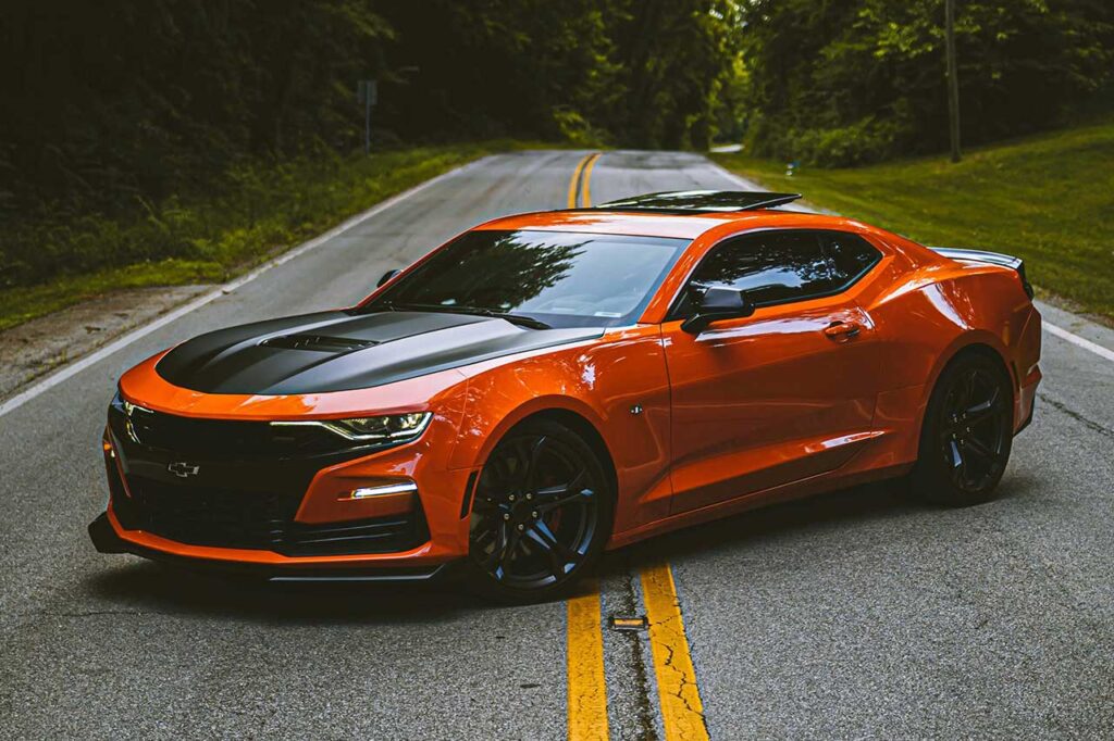 orange chevy camaro with carbon fiber good